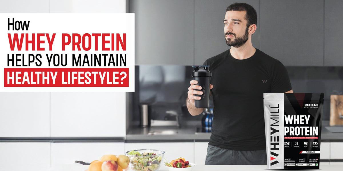 Man holding whey protein shaker in a modern kitchen representing how whey protein supports a healthy lifestyle.